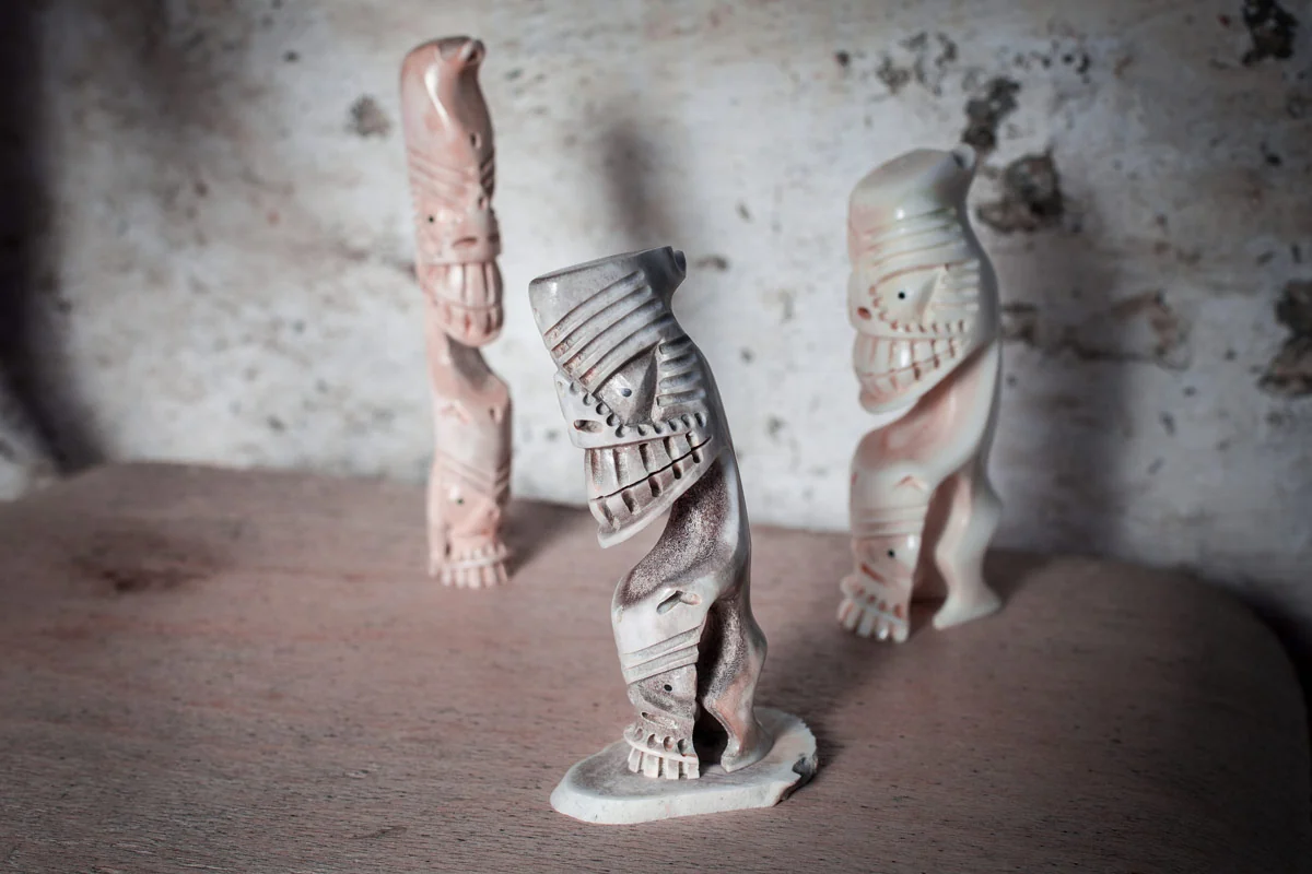 Traditional Greenlandic tupilak carvings on display